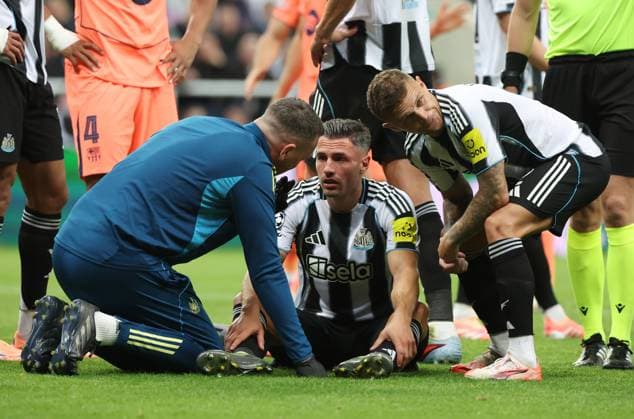 Newcastle Upon Tyne, England, 18th September 2025. A dazed Fabian Schar of Newcastle United receives treatment after being hit in the face by a Marcus Rashford shot during the Newcastle United vs FC Barcelona, Barca UEFA Champions League match at St. James Park, Newcastle Upon Tyne. Picture credit should read: Nigel Roddis Sportimage EDITORIAL USE ONLY. No use with unauthorised audio, video, data, fixture lists, club league logos or live services. Online in-match use limited to 120 images, no video emulation. No use in betting, games or single club league player publications. SPI_041_NR_Newcastle_Barca SPI-4145-0041