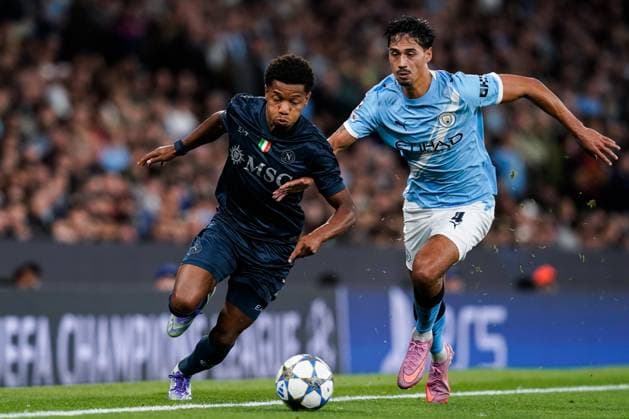 Manchester, England, 18th September 2025. David Neres of SSC Napoli in action under pressure from Tijjani Reijnders of Manchester City during the Manchester City vs Napoli UEFA Champions League match at the Etihad Stadium, Manchester. Picture credit should read: Andrew Yates Sportimage EDITORIAL USE ONLY. No use with unauthorised audio, video, data, fixture lists, club league logos or live services. Online in-match use limited to 120 images, no video emulation. No use in betting, games or single club league player publications. SPI_061_AY_MCI_NAP SPI-4144-0108