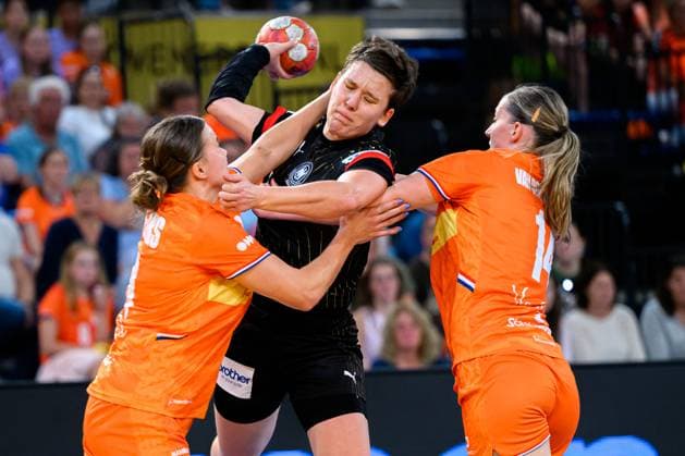 Eindhoven handball women national match Netherlands Germany from left in a duel Merel Freriks Netherlands , Alina Grijseels Germany , Judith van der Helm Netherlands Eindhoven Netherlands