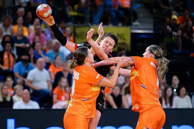 Eindhoven handball women national match Netherlands Germany from left in a duel Merel Freriks Netherlands , Alina Grijseels Germany , Judith van der Helm Netherlands Eindhoven Netherlands