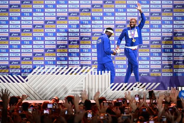(250920) -- TOKYO, Sept. 20, 2025 -- Gold medalist Noah Lyles (R) of the United States waves to the crowd after during the men s 200m awarding ceremony at the 2025 World Athletics Championships in Tokyo, Japan, Sept. 20, 2025. ) (SP)JAPAN-TOKYO-ATHLETICS-WORLD ATHLETICS CHAMPIONSHIPS-MEN S 200M-AWARDING CEREMONY JiangxHan 