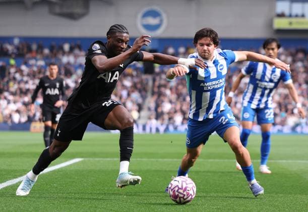 Brighton and Hove, England, 20th September 2025. Mohammed Kudus of Tottenham Hotspur and Ferdi KadÄ±oglu of Brighton and Hove Albion challenge for the ball during the Brighton and Hove Albion vs Tottenham Hotspur Premier League match at the AMEX Stadium, Brighton and Hove. Picture credit should read: Paul Terry Sportimage EDITORIAL USE ONLY. No use with unauthorised audio, video, data, fixture lists, club league logos or live services. Online in-match use limited to 120 images, no video emulation. No use in betting, games or single club league player publications. SPI_021_PT_Brighton_Tottenham SPI-4150-0021