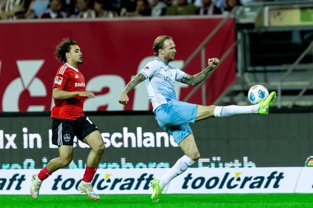 Football, Season 2025 2026, 2 Bundesliga, Max Morlock Stadion, Matchday 6, 1 FC Nürnberg VfL Bochum, 20 09 2025 20 09 2025, Football, Season 2025 2026, 2 Bundesliga, Max Morlock Stadion, Matchday 6, 1 FC Nürnberg VfL Bochum, f l 18 Rafael Lubach 1 FC Nürnberg , 7 Kevin Vogt VfL Bochum Photo Lucca Fundel Nürnberg Max Morlock Stadion Bayern Germany