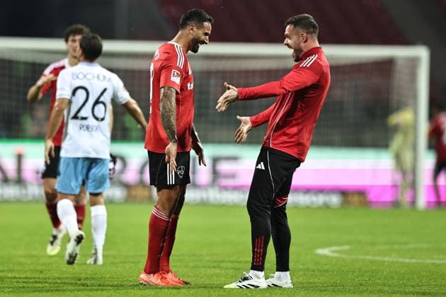 Adriano Grimaldo and Christian Mathenia, FCN, cheer after the first round match of the 2025 2026 season between 1 FC Nuremberg and Vfl Bochum 2 1 in Nuremberg 20 09 2025