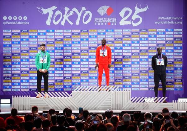 (250921) -- TOKYO, Sept. 21, 2025 -- Gold medalist Emmanuel Wanyonyi (C) of Kenya, silver medalist Djamel Sedjati (L) of Algeria and bronze medalist Marco Arop of Canada pose during the men s 800m awarding ceremony at the 2025 World Athletics Championships in Tokyo, Japan, Sept. 21, 2025. ) (SP)JAPAN-TOKYO-ATHLETICS-WORLD ATHLETICS CHAMPIONSHIPS-MEN S 800M-AWARDING CEREMONY JiaxHaocheng 