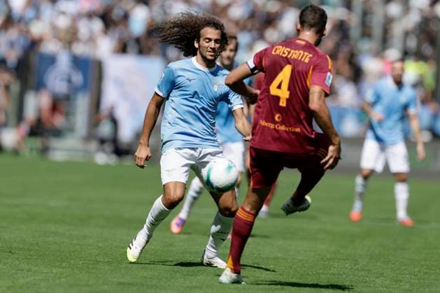 Serie A football match SS Lazio vs AS Roma Lazio s French midfielder Matteo Guendouzi challenges for the ball with Roma™s Italian midfielder Bryan Cristante during the Serie A football match SS Lazio vs AS Roma at Olimpico Stadium on September 21, 2025, in Rome. _BPH2407 Copyright: xAntonioxBalascox