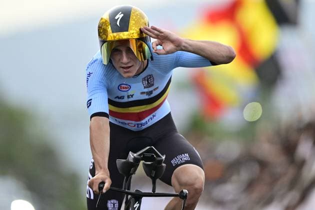 Belgian Remco Evenepoel celebrates and shows the number of his victories, three, at the arrival of the Men Elite Individual Time Trial race (40,8km) at the cycling road world championships, in Kigali, Rwanda, Sunday 21 September 2025. The 2025 UCI Road World Championships take place from 21 to 28 September in Kigali, Rwanda. DIRKxWAEM  x134918288x