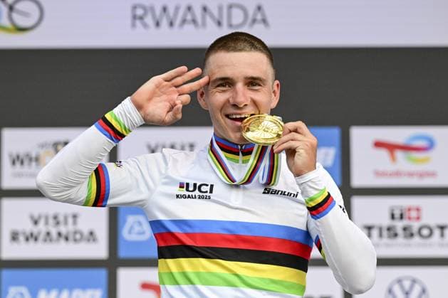 Belgian Remco Evenepoel celebrates and shows his gold medal and the number of his victories, three on a row, on the podium of the Men Elite Individual Time Trial race (40,8km) at the cycling road world championships, in Kigali, Rwanda, Sunday 21 September 2025. The 2025 UCI Road World Championships take place from 21 to 28 September in Kigali, Rwanda. DIRKxWAEM  x134927343x