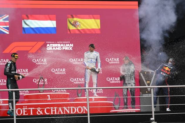 (250922) -- BAKU, Sept. 22, 2025 -- Winner Red Bull Racing s Dutch driver Max Verstappen (1st R), second-placed Mercedes British driver George Russell (1st L) and third-placed Williams Spanish driver Carlos Sainz (2nd L) celebrate during the awarding ceremony after the race of the 2025 Formula One Azerbaijan Grand Prix in Baku, Azerbaijan, Sept. 21, 2025. (Photo by Xinhua) (SP)AZERBAIJAN-BAKU-F1-AZERBAIJAN GRAND PRIX-RACE TofikxBabayev 