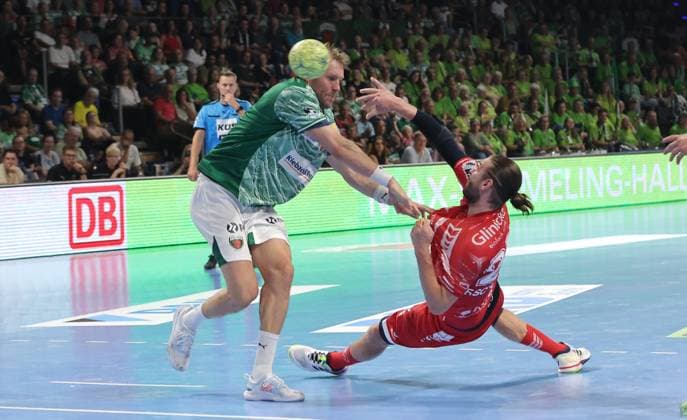 Max Darj in a duel with Olle Forsell Schefvert Action Match scene Sport Handball HBL Bundesliga Men 5 Matchday Season 2025 2026 21 09 2025 Füchse Berlin vs MT Melsungen