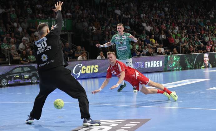 Goalkeeper Dejan Milosavljev saves against Timo Kastening, Lasse Andersson duel Game scene Action Sport Handball HBL Bundesliga Men 5 Matchday Season 2025 2026 21 09 2025 Füchse Berlin vs MT Melsungen