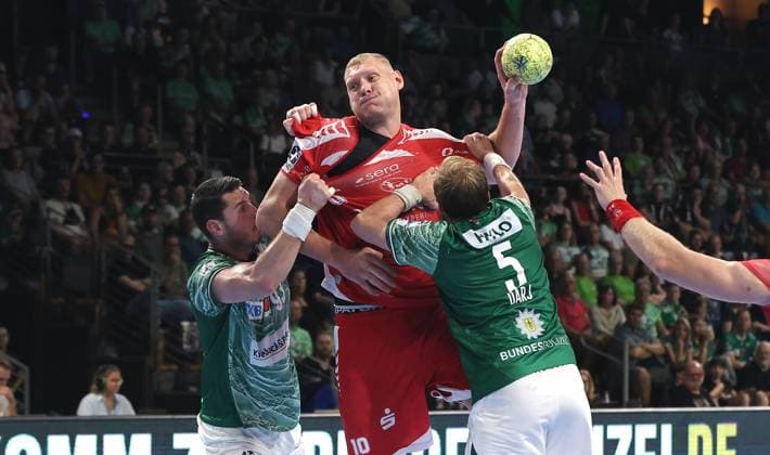 Mijajlo Marsenic, Dainis Kristopans on the ball, Max Darj duel Game scene Action Sport Handball HBL Bundesliga Men 5 Matchday Season 2025 2026 21 09 2025 Füchse Berlin vs MT Melsungen