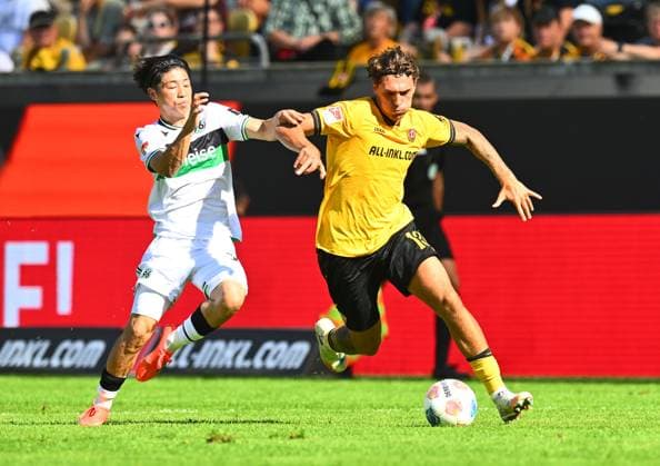 v l Daisuke Yokota Hannover , Julian Pauli Dresden , 21 09 2025, Fußball, GER, Saison 2025 2026, 2 Bundesliga, Zweite Liga, 6 Spieltag, Rudolf Harbig Stadion Dresden, SG Dynamo Dresden Hannover 96, DFB AND DFL REGULATIONS PROHIBIT ANY USE OF PHOTOGRAPHS as IMAGE SEQUENCES and or QUASI VIDEO,