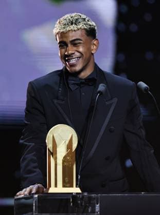 (250923) -- PARIS, Sept. 23, 2025 -- Barcelona s Spanish player Lamine Yamal speaks after receiving the Kopa Trophy for the best under-21 player during the 2025 Ballon d Or France Football award ceremony at the Theatre du Chatelet in Paris, France, on Sept. 22, 2025. ) (SP)FRANCE-PARIS-FOOTBALL-BALLON D OR CEREMONY GaoxJing 