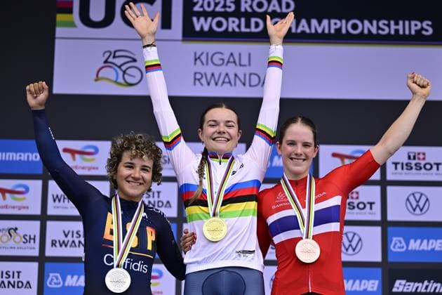L-R, silver medalist Spanish Paula Taco Ostiz, winner world champion Dutch Megan Arens and bronze medalist Norwegian Oda Aune Gissinger celebrate on the podium of the Women Junior Individual Time Trial race (18,3km) at the cycling road world championships, in Kigali, Rwanda, Tuesday 23 September 2025. The 2025 UCI Road World Championships take place from 21 to 28 September in Kigali, Rwanda. DIRKxWAEM  x135068678x