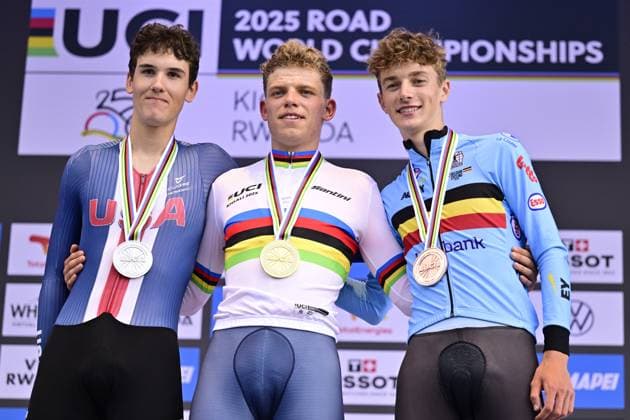 American Ashlin Barry, Dutch Michiel Mouris and Belgian Mats Vanden Eynde celebrate on the podium of the Men Junior Individual Time Trial race (22,6km) at the cycling road world championships, in Kigali, Rwanda, Tuesday 23 September 2025. The 2025 UCI Road World Championships take place from 21 to 28 September in Kigali, Rwanda. DIRKxWAEM  x135080945x