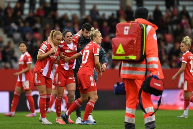 Glodis Viggosdottir 4 FC Bayern supports her teammate Sarah Zadrazil 25 FC Bayern after a foul during the Google Pixel Womens Bundesliga match FC Bayern Munich SC Freiburg on 23 09 2025 Munich FC Bayern Campus Bayern Germany