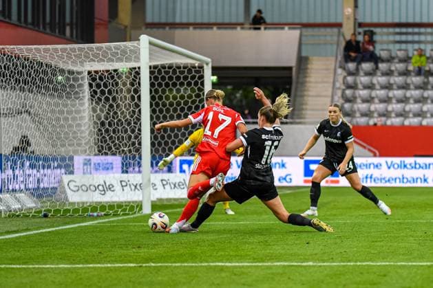 Klara Bühl 17 FC Bayern and Greta Stegemann 16 Freiburg in action at the Google Pixel Womens Bundesliga match FC Bayern Munich SC Freiburg on 23 09 2025 Munich FC Bayern Campus Bayern Germany