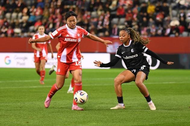 Momoko Tanikawa 18 Bayern and Nicole Ojukwu 6 Freiburg in action at the Google Pixel Womens Bundesliga match FC Bayern Munich SC Freiburg on 23 09 2025 Munich FC Bayern Campus Bayern Germany