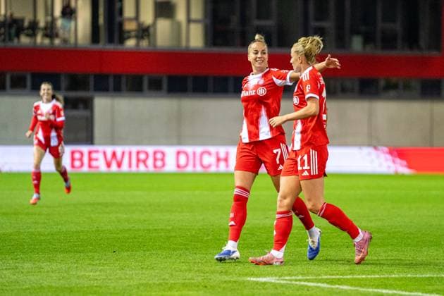 Giulia Gwinn 7 FC Bayern and Lea Schüller 11 Bayern celebrate the 3-0 goal during the Google Pixel Womens Bundesliga match FC Bayern Munich SC Freiburg on 23 09 2025 Munich FC Bayern Campus Germany