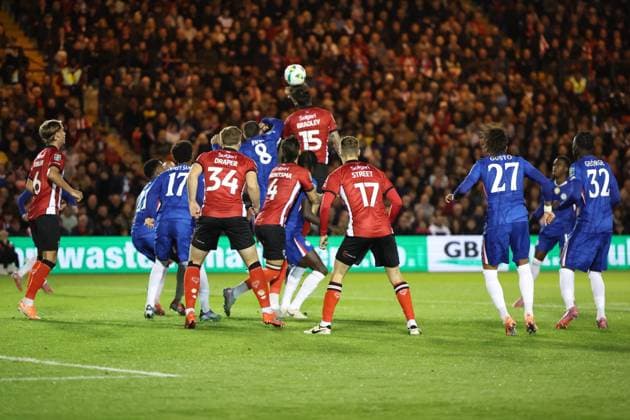 Lincoln City v Chelsea EFL Cup 23 09 2025. Lincoln City defender Sonny Bradley (15) heads on a cross during the EFL Cup match between Lincoln City and Chelsea at Sincil Bank, Lincoln, United Kingdom on 23 September 2025. Lincoln Sincil Bank Lincs United Kingdom Editorial use only DataCo restrictions apply See www.football-dataco.com , Copyright: xJohnxMallettx PSI-22888-0024