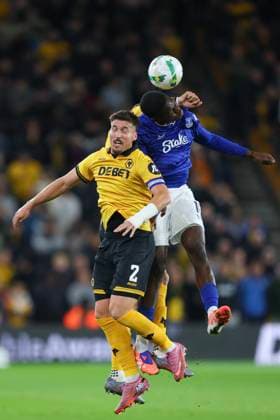 Wolverhampton, England, 23rd September 2025. Thierno Barry of Everton and Matt Doherty of Wolverhampton Wanderers during the Wolverhampton Wanderers vs Everton Carabao Cup match at Molineux, Wolverhampton. Picture credit should read: James Baylis Sportimage EDITORIAL USE ONLY. No use with unauthorised audio, video, data, fixture lists, club league logos or live services. Online in-match use limited to 120 images, no video emulation. No use in betting, games or single club league player publications. SPI_15_JB_WOL_EVE SPI-4157-0015