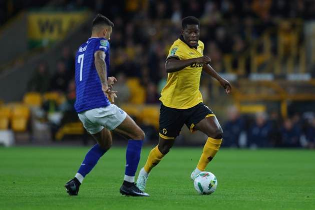 Wolverhampton, England, 23rd September 2025. Marshall Munetsi of Wolverhampton Wanderers and Dwight McNeil of Everton during the Wolverhampton Wanderers vs Everton Carabao Cup match at Molineux, Wolverhampton. Picture credit should read: James Baylis Sportimage EDITORIAL USE ONLY. No use with unauthorised audio, video, data, fixture lists, club league logos or live services. Online in-match use limited to 120 images, no video emulation. No use in betting, games or single club league player publications. SPI_19_JB_WOL_EVE SPI-4157-0019