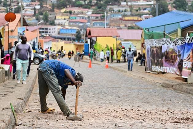 A worker repairs a cobblestone road at the track of the cycling road World Championships, in Kigali, Rwanda, Wednesday 24 September 2025. The 2025 UCI Road World Championships take place from 21 to 28 September in Kigali, Rwanda. DIRKxWAEM  x135147358x