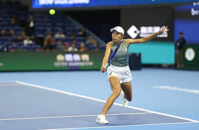 (250924) -- BEIJING, Sept. 24, 2025 -- Zhang Shuai returns a shot during the women s singles first round match between Anastasia Zakharova of Russia and Zhang Shuai of China at 2025 China Open tennis tournament in Beijing, China, Sept. 24, 2025. ) (SP)CHINA-BEIJING-TENNIS-CHINA OPEN-WOMEN S SINGLES-FIRST ROUND (CN) BaixXuefei 