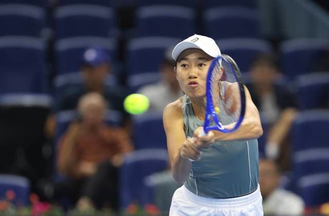 (250924) -- BEIJING, Sept. 24, 2025 -- Zhang Shuai returns a shot during the women s singles first round match between Anastasia Zakharova of Russia and Zhang Shuai of China at 2025 China Open tennis tournament in Beijing, China, Sept. 24, 2025. ) (SP)CHINA-BEIJING-TENNIS-CHINA OPEN-WOMEN S SINGLES-FIRST ROUND (CN) BaixXuefei 