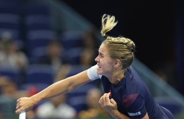 (250924) -- BEIJING, Sept. 24, 2025 -- Anastasia Zakharova serves during the women s singles first round match between Anastasia Zakharova of Russia and Zhang Shuai of China at 2025 China Open tennis tournament in Beijing, China, Sept. 24, 2025. ) (SP)CHINA-BEIJING-TENNIS-CHINA OPEN-WOMEN S SINGLES-FIRST ROUND (CN) BaixXuefei 