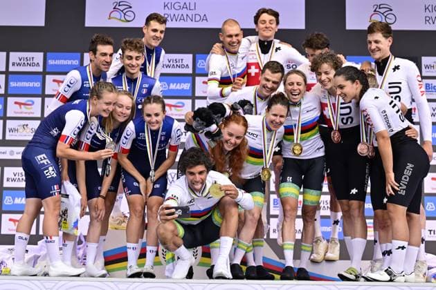 French, Australian and Swiss cyclists celebrate on the podium of the Team Time Trial Mixed Relay race (41,8km) at the cycling road world championships, in Kigali, Rwanda, Wednesday 24 September 2025. The 2025 UCI Road World Championships take place from 21 to 28 September in Kigali, Rwanda. DIRKxWAEM  x135169786x