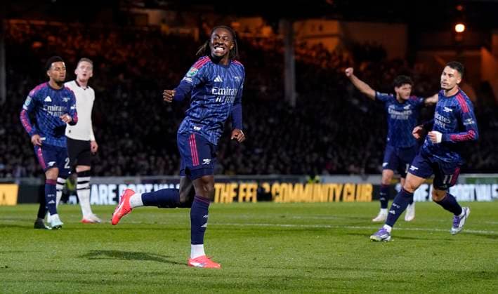 Burslem, England, 24th September 2025. Eberechi Eze of Arsenal (C) celebrates after scoring the opening goal during the Port Vale vs Arsenal Carabao Cup match at Vale Park, Burslem. Picture credit should read: Andrew Yates Sportimage EDITORIAL USE ONLY. No use with unauthorised audio, video, data, fixture lists, club league logos or live services. Online in-match use limited to 120 images, no video emulation. No use in betting, games or single club league player publications. SPI_006_AY_PORT_VALE_ARSENAL SPI-4158-0006