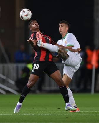 Nice, France, 24th September 2025. Gianluca Mancini of AS Roma challenges Kevin Carlos of OGC Nice during the OGC Nice vs AS Roma UEFA Europa League match at Gran Stade de Nice, Nice. Picture credit should read: Jonathan Moscrop Sportimage EDITORIAL USE ONLY. No use with unauthorised audio, video, data, fixture lists, club league logos or live services. Online in-match use limited to 120 images, no video emulation. No use in betting, games or single club league player publications. SPI_004_JM_OGCNICE_ROMA_UEL SPI-4156-0004