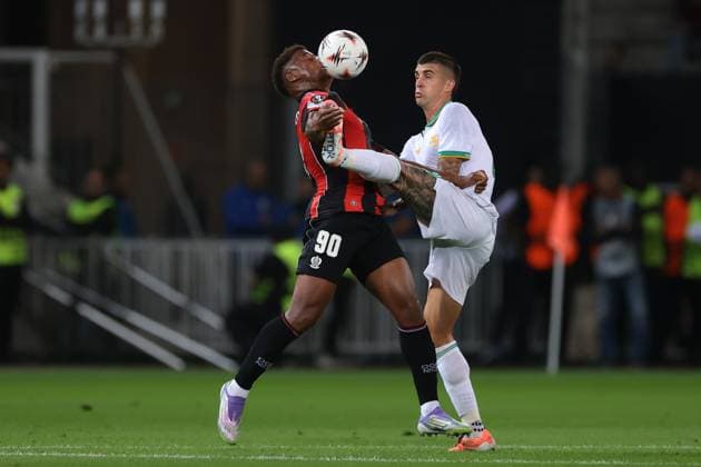 Nice, France, 24th September 2025. Gianluca Mancini of AS Roma challenges Kevin Carlos of OGC Nice during the OGC Nice vs AS Roma UEFA Europa League match at Gran Stade de Nice, Nice. Picture credit should read: Jonathan Moscrop Sportimage EDITORIAL USE ONLY. No use with unauthorised audio, video, data, fixture lists, club league logos or live services. Online in-match use limited to 120 images, no video emulation. No use in betting, games or single club league player publications. SPI_005_JM_OGCNICE_ROMA_UEL SPI-4156-0005