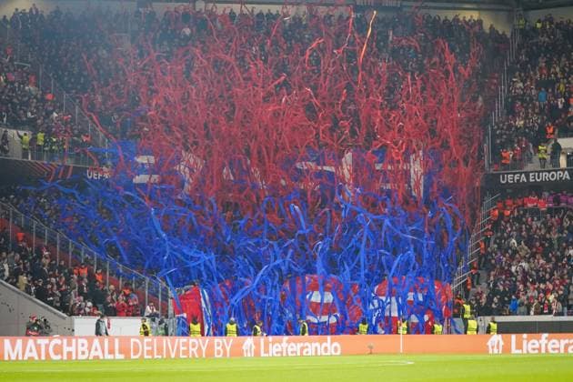 Football UEFA Europa League 2025 26, Matchday 1 SC Freiburg vs FC Basel Europa Park Stadion Freiburg Choreography of FC Basel fans with red and blue streamers, impressive fan staging in the guest block, colorful support, UEFA competition, emotions and fan culture, security forces on the sidelines Freiburg im Breisgau Baden Württemberg Germany Copyright: xJOERANxSTEINSIEKx