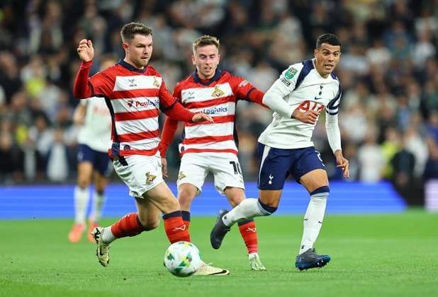 Pedro Porro of Tottenham Hotspur competes for the ball with Ian Lawlor of Doncaster Rovers and Glenn Middleton of Doncaster Rovers Tottenham Hotspur v Doncaster Rovers, EFL Carabao Cup, Third Round, Football, Tottenham Hotspur Stadium, London, UK - 24 Sep 2025London Tottenham Hotspur Stadium United Kingdom EDITORIAL USE ONLY No use with unauthorised audio, video, data, fixture lists, club league logos or live services. Online in-match use limited to 120 images, no video emulation. No use in betting, games or single club league player publications. Copyright: xMichaelxZemanek Shutterstockx 15498598t