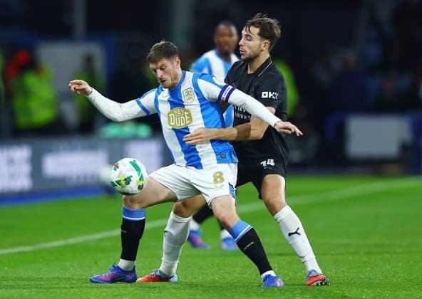 Ben Wiles of Huddersfield Town and Nico Gonzalez of Manchester City Huddersfield Town v Manchester City, EFL Carabao Cup, Third Round, Football, Accu Stadium, Huddersfield, UK - 24 Sep 2025Huddersfield Accu Stadium United Kingdom EDITORIAL USE ONLY No use with unauthorised audio, video, data, fixture lists, club league logos or live services. Online in-match use limited to 120 images, no video emulation. No use in betting, games or single club league player publications. Copyright: xMattxWest Shutterstockx 15498595ap