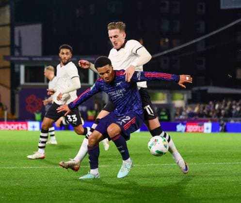 24th September 2025; Vale Park, Stoke, Staffordshire, England; EFL Carabao Cup Football, Port Vale versus Arsenal; Ethan Nwaneri of Arsenal under pressure from Ronan Curtis of Port Vale  RogerxEvans