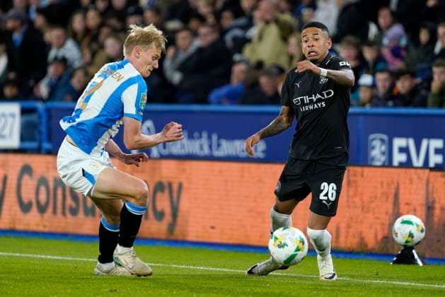 Huddersfield Town v Manchester City, UK - 23 Sep 2025 Savinho of Manchester City battles for the ball with Lasse Sorensen of Huddersfield Town during the Carabao Cup Match between Huddersfield Town and Manchester City at Accu Stadium, Huddersfield on 24 September 2025. Huddersfield Accu Stadium GBR Copyright: xHarryxCornish PPAUKx PPA-217660