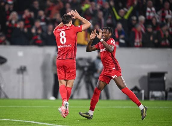 FOOTBALL EUROPA LEAGUE SEASON 2025 2026 1 Matchday 24 09 2025 SC Freiburg FC Basel CELEBRATION SC Freiburg Goalscorers for 2 0 Maximilian Eggestein left and Junior Adamu right