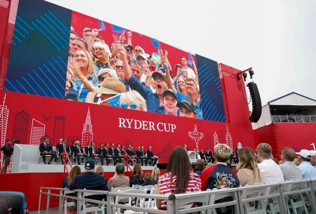 Spectators cheer as Team Europe Ryder captain Luke Donald of England speaks during the opening ceremony for the 45th Ryder Cup at The Black Course at Bethpage State Park in Farmingdale, New York, on Wednesday, September 24, 2025. The three-day golf tournament starts on Friday, September 26, 2025.  RYD20250924835 JOHNxANGELILLO