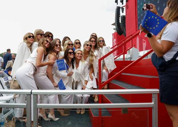 The wives and partners of Team Europe golfers pose for a group photo at the opening ceremony for the 45th Ryder Cup at The Black Course at Bethpage State Park in Farmingdale, New York, on Wednesday, September 24, 2025. The three-day golf tournament starts on Friday, September 26, 2025.  RYD20250924842 JOHNxANGELILLO
