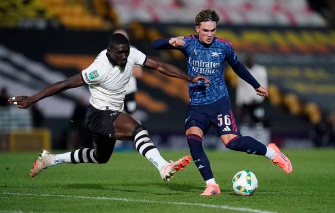 Burslem, England, 24th September 2025. Max Dowman of Arsenal (R) has his shot blocked by Jesse Debrah of Port Vale during the Port Vale vs Arsenal Carabao Cup match at Vale Park, Burslem. Picture credit should read: Andrew Yates Sportimage EDITORIAL USE ONLY. No use with unauthorised audio, video, data, fixture lists, club league logos or live services. Online in-match use limited to 120 images, no video emulation. No use in betting, games or single club league player publications. SPI_020_AY_PORT_VALE_ARSENAL SPI-4158-0021