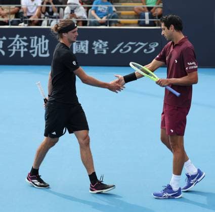 (250925) -- BEIJING, Sept. 25, 2025 -- Marcelo Melo (R) Alexander Zverev react during the men s doubles first round match between Bu Yunchaokete (China) Cameron Norrie (Britain) and Marcelo Melo (Brazil) Alexander Zverev (Germany) at 2025 China Open tennis tournament in Beijing, China, Sept. 25, 2025. (Photo by Xinhua) (SP)CHINA-BEIJING-TENNIS-CHINA OPEN-MEN S DOUBLES-FIRST ROUND (CN) MaxZihan 