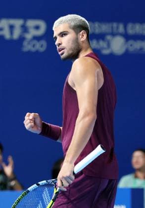 September 25, 2025, Tokyo, Japan - Carlos Alcaraz of Spain clinches his fist as he won a key point against Sebastian Baez of Argentina during a single round 32 match at the the Japan Open Tennis tournament in Tokyo on Thursday, September 25, 2025. Alcaraz defeated Baez 6-4, 6-2. (photo by Yoshio Tsunoda AFLO) Noxthirdxpartyxsales  aflo_304734371