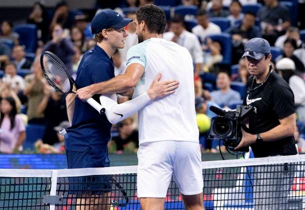 (250925) -- BEIJING, Sept. 25, 2025 -- Jannik Sinner (L) and Marin Cilic hug each other after the men s singles first round match between Jannik Sinner of Italy and Marin Cilic of Croatia at 2025 China Open tennis tournament in Beijing, China, Sept. 25, 2025. ) (SP)CHINA-BEIJING-TENNIS-CHINA OPEN-MEN S SINGLES-FIRST ROUND (CN) HuxJingwen 
