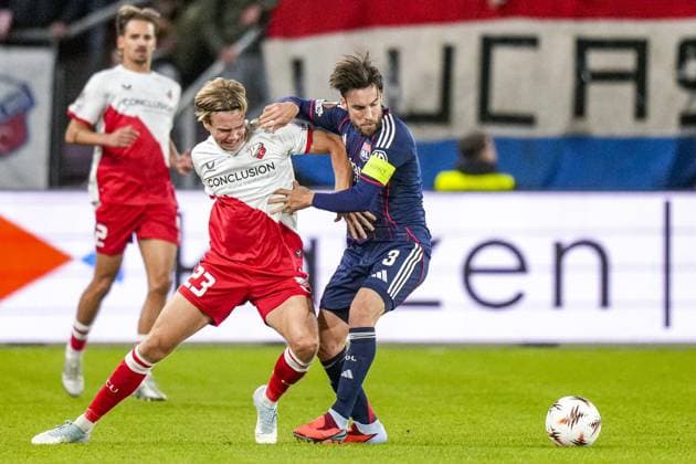 UTRECHT , 25-09-2025 , stadium Galgenwaard , season 2025 2026 , UEFA Europa League football , League phase Matchday 1 , match between FC Utrecht and Olympique Lyon , picture shows FC Utrecht player Niklas Vesterlund and Olympique Lyonnais player Nicolas Tagliafico Utrecht - Olympique Lyon  x31193872x Copyright: