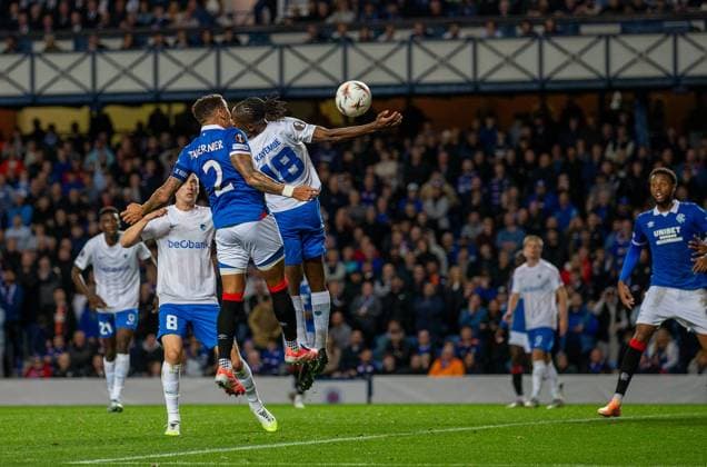 25th September 2025; Ibrox Stadium, Glasgow, Scotland; UEFA Europa League Football, Rangers versus Genk; James Tavernier of Rangers header appears to come off Joris Kayembe of KRC Genk arm leading to a VAR check  VagelisxGeorgariou