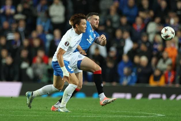 Hyeongyu Oh of Genk battles for the ball with John Souttar of Rangers during the Europa League league phase match at Ibrox Stadium, Glasgow. Rangers v Genk - UEFA Europa League - League Phase - Ibrox Stadium, Glasgow, Lanarkshire, Scotland, UK - 25 Sep 2025Glasgow Ibrox Lanarkshire United Kingdom  Copyright: xO Rourke RangersxFC Shutterstockx 15504270at